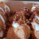 EPCOT's Sunshine Griddle served these Fried Cinnamon Roll Bites as their dessert special for the Flower and Garden Festival. They were fried dough balls topped with cream cheese frosting and candied bacon.